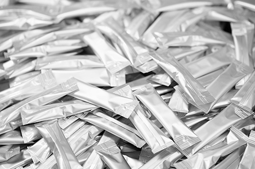 background heap of many clean packing aluminium for powders or soluble beverages or medicines